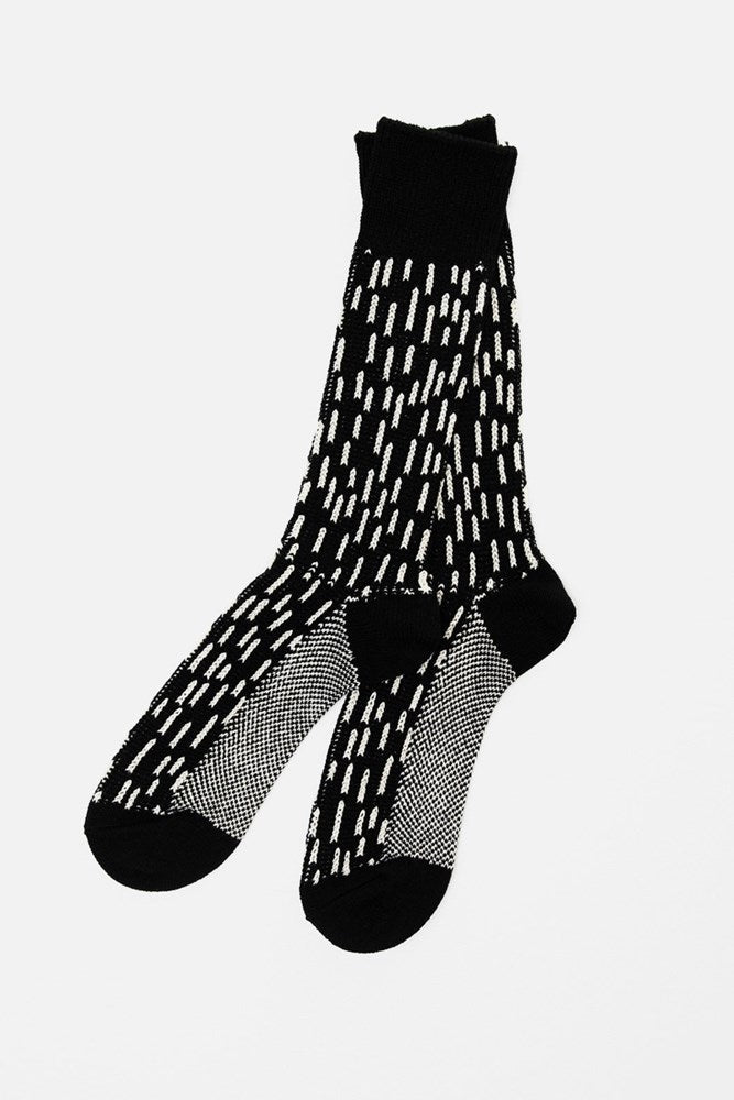 RoToTo Rain Drop Socks in Black Ivory by RoToTo feature white, dashed vertical patterns with solid black heels, toes, and cuffs, shown on a white background.