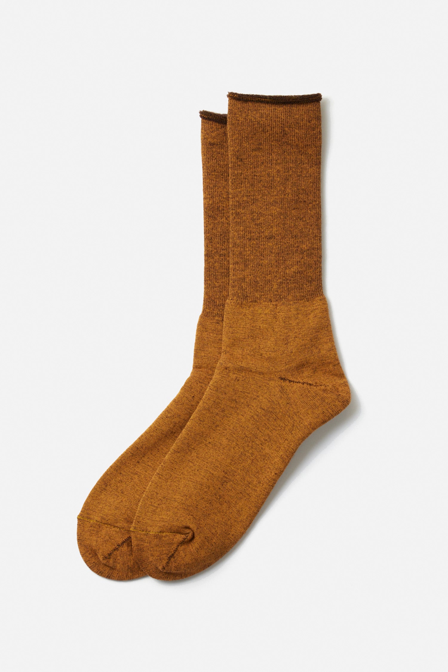 A pair of RoToTo City Socks in Yellow Brown, featuring a crew length and slightly heathered merino wool texture, are placed side by side on a plain white background.