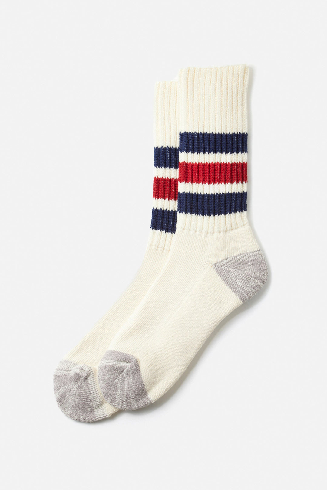 The RoToTo Coarse Ribbed Old School Socks in Navy Dark Red, by RoToTo, feature two navy and two red stripes near the cuffs, light gray heels and toes, are made in Japan, and are shown on a plain white background.