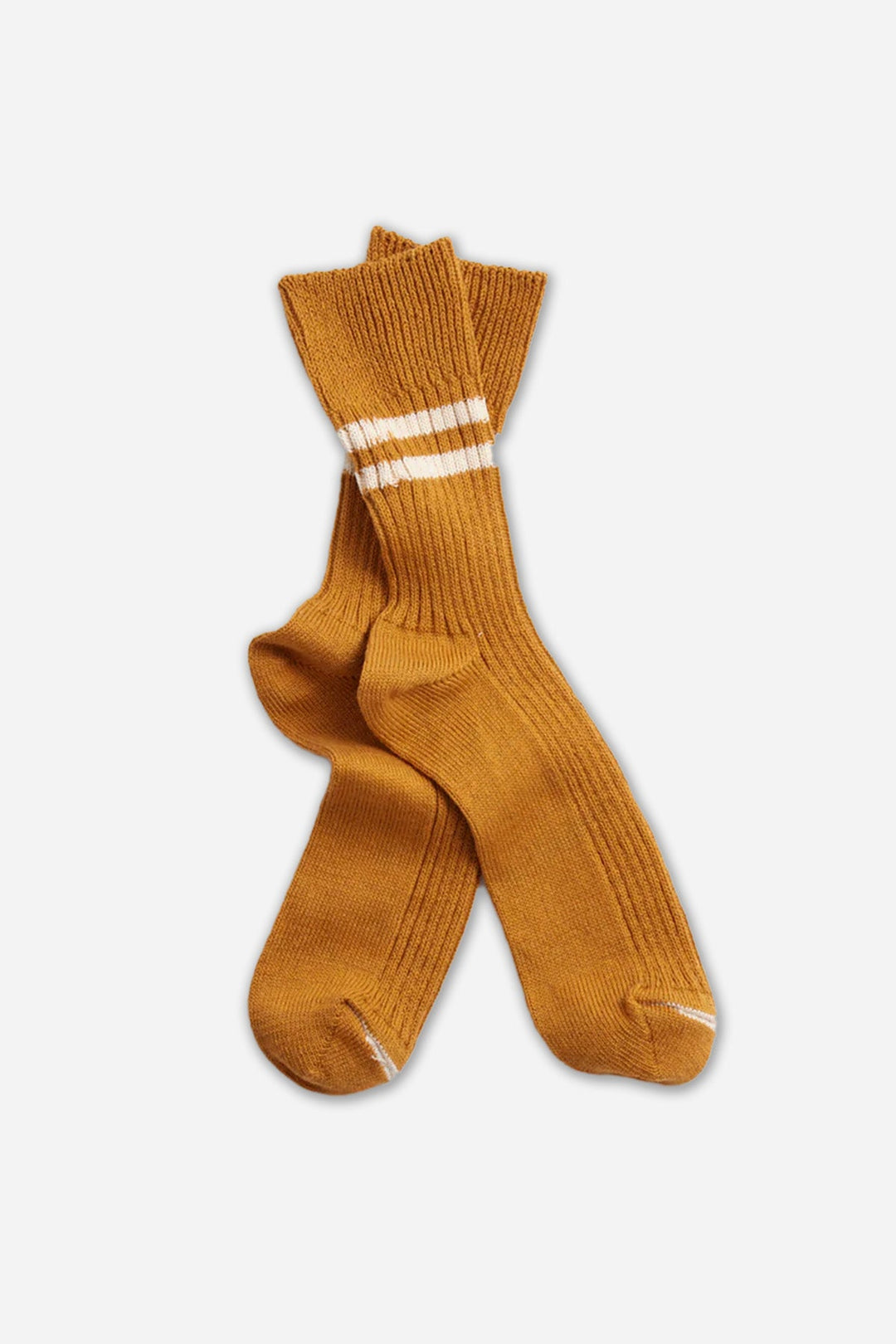 The RoToTo Hemp Organic Cotton Stripe Socks in Sunset Gold feature mustard yellow ribbed fabric with two white stripes near the top. Made in Japan, these socks offer comfort and timeless style from RoToTo.
