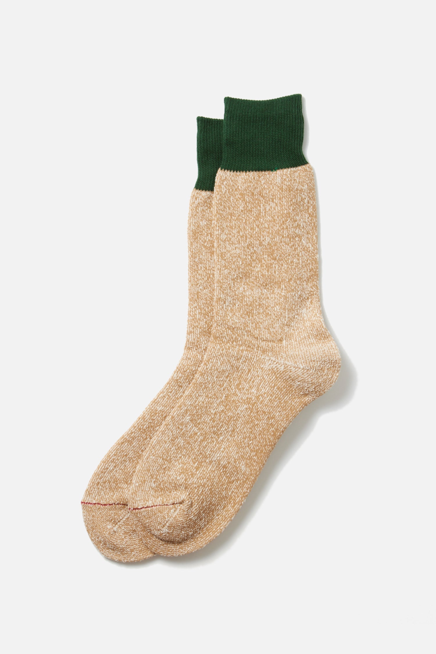 A pair of RoToTo Double Face Silk Cotton Crew Socks in dark green and beige, featuring textured fabric and ribbed cuffs, are laid overlapping on a plain white background.