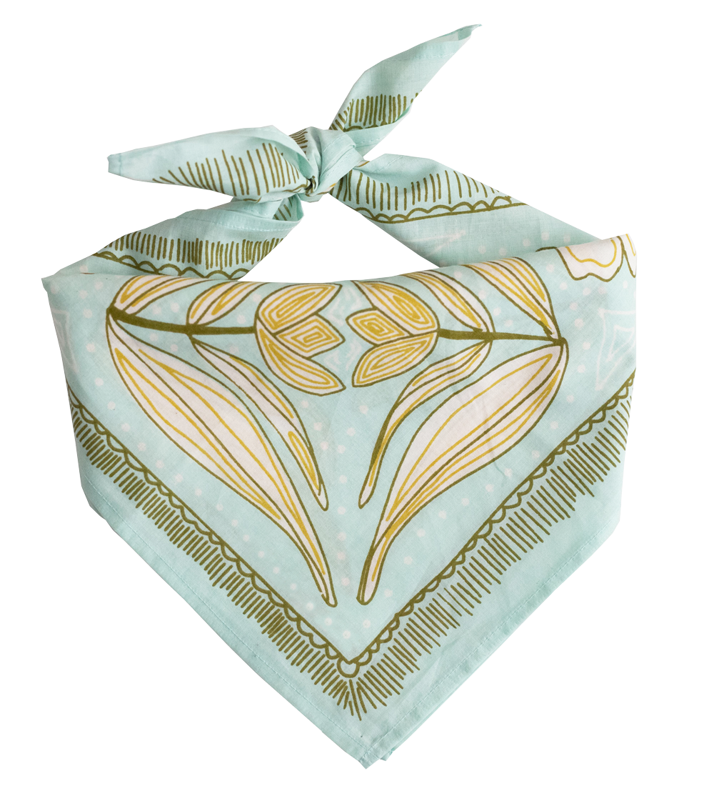 The No. 012 Eliza Bandana by Handker Bandanas features a light blue background with green and gold botanical patterns, crafted from premium cotton, neatly folded and knotted at the top, and displayed on a plain white background.