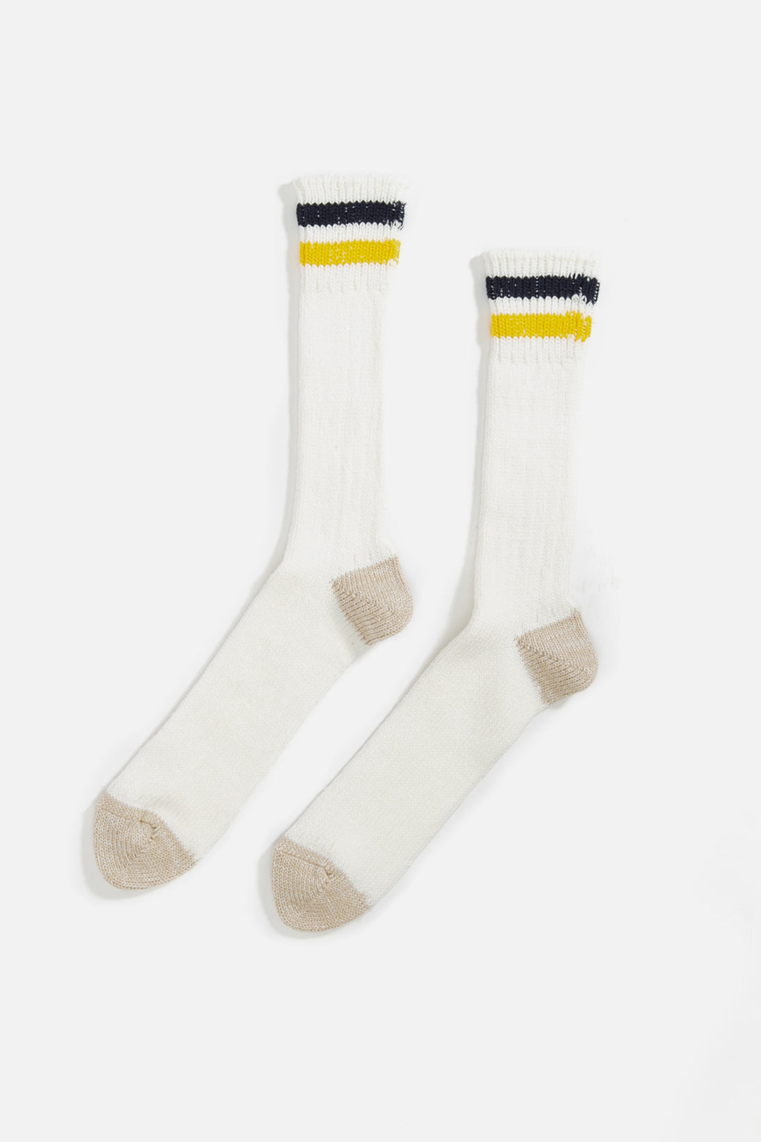A pair of RoToTo OS Ribbed Crew Socks in Navy Yellow, made from organic cotton with beige heels and toes, featuring yellow and black stripes near the top. They are shown laid flat on a white background.