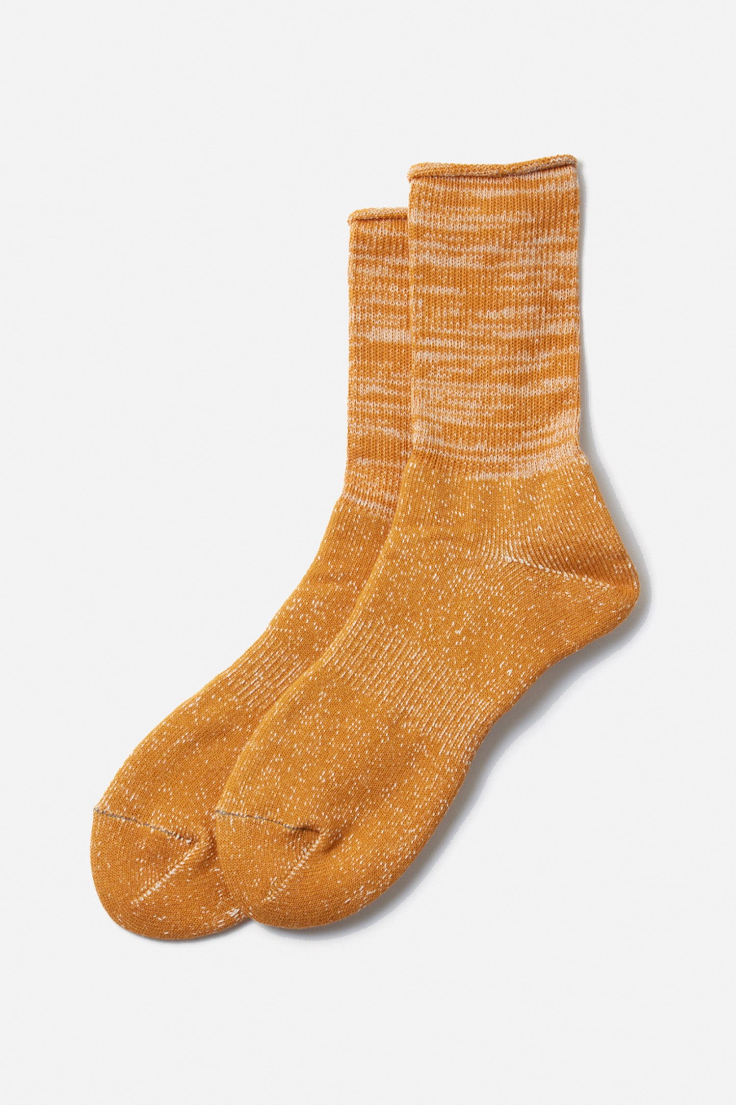 The RoToTo Washi Pile Crew Socks in dark yellow feature a ribbed upper and traditional Japanese paper yarn style, shown on a plain white background.
