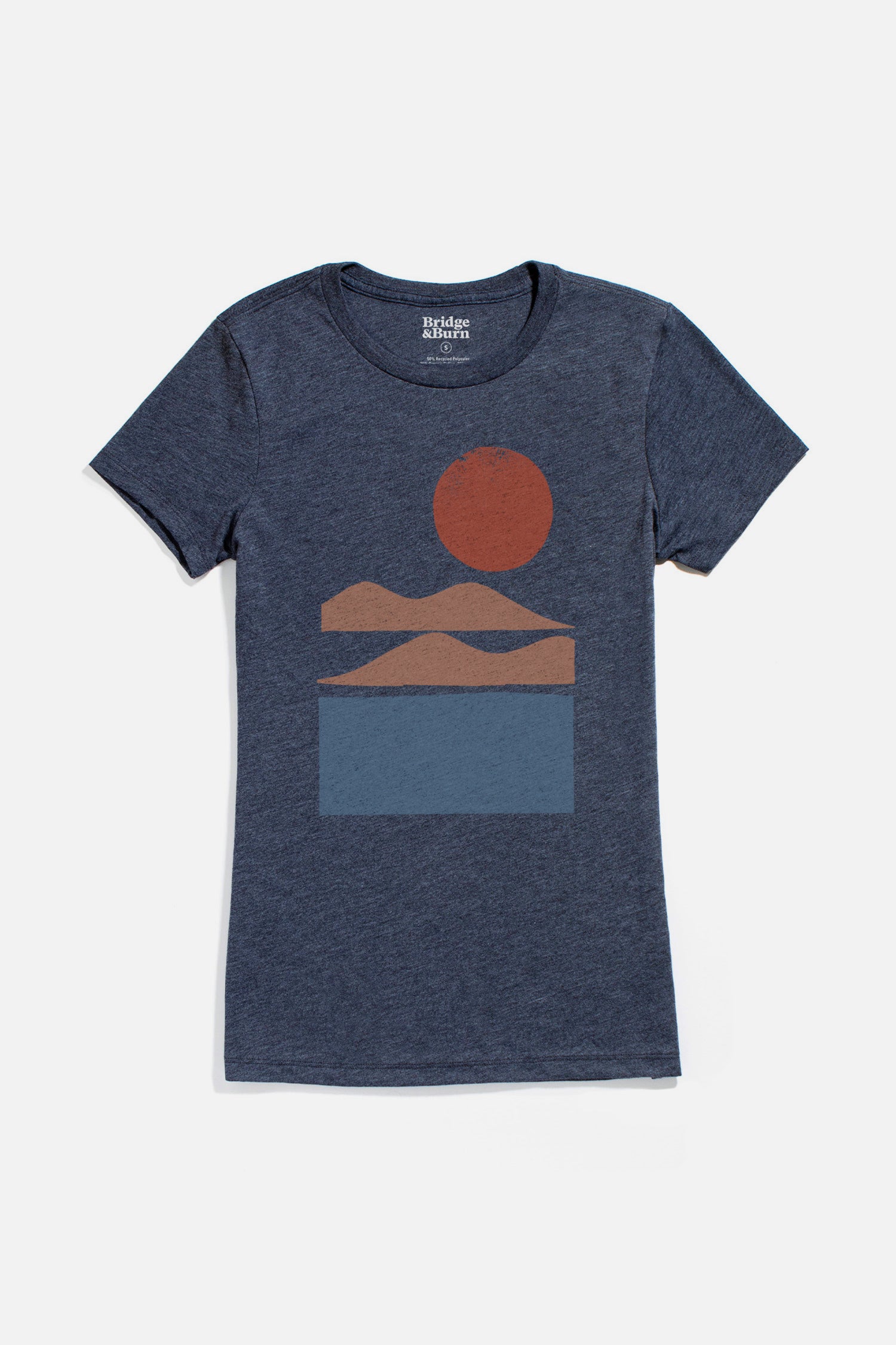 Bridge & Burn Women's Alpenglow Tee in navy: a lightweight organic cotton shirt with a minimalist red sun, orange mountains, and blue water graphic.