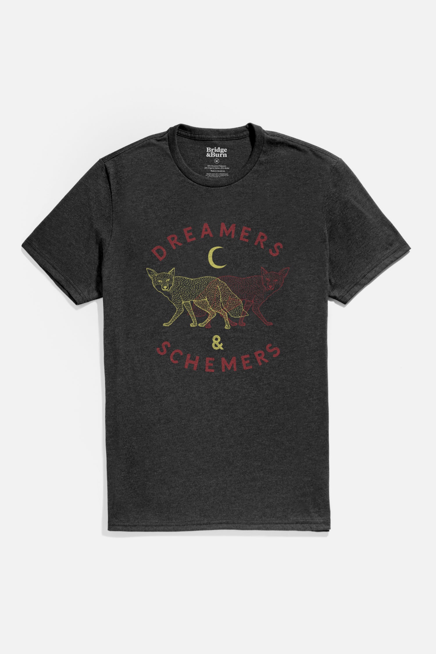 The Bridge & Burn Men's Dreamers & Schemers Tee in black is a lightweight shirt with yellow and red fox outlines, a crescent moon, and "DREAMERS & SCHEMERS" curved around the design.