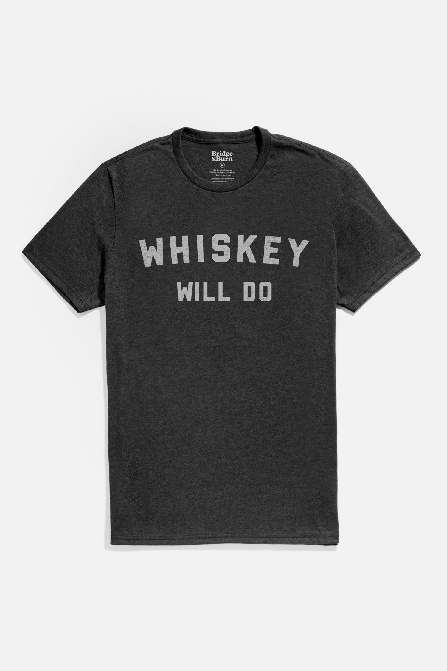 Bridge & Burn Men's Whiskey Will Do Tee in black features "WHISKEY WILL DO" in bold white print on organic cotton. Lightweight and perfect for casual comfort, it’s shown laid flat on a light background.