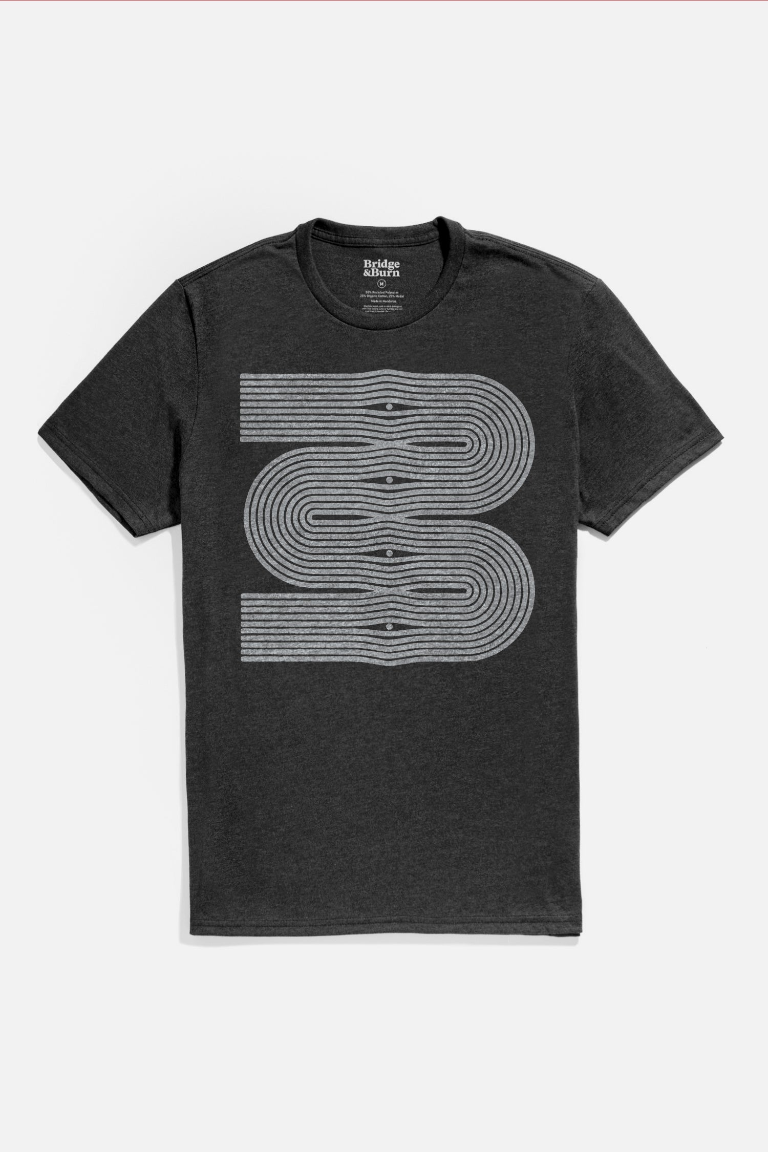 The Bridge & Burn Men's Side Winder Tee in black is a lightweight organic cotton shirt, featuring an abstract geometric front design with three stacked, overlapping white curved lines and dots.