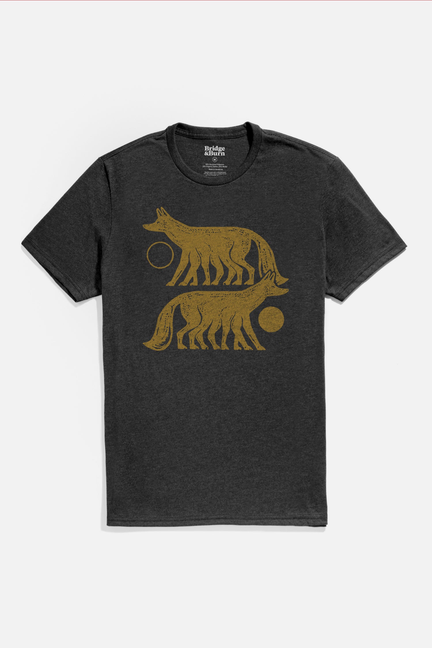 The Bridge & Burn Men's Night Watch Tee in black is a lightweight, organic cotton shirt featuring two stylized six-legged gold foxes, positioned horizontally with circles near their heads, one above the other on the front.
