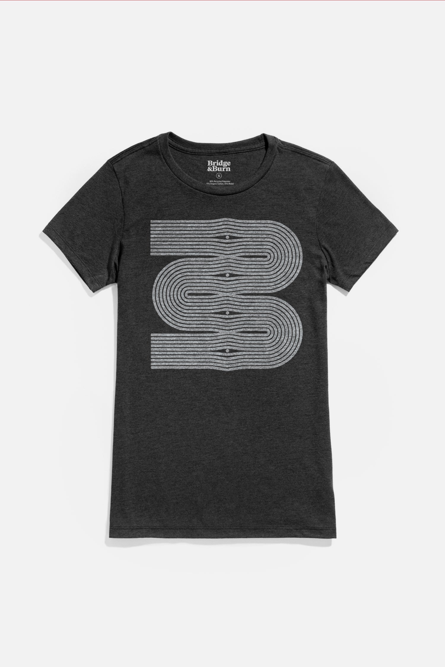 The Bridge & Burn Women's Side Winder Tee in black features a white, abstract geometric line design on the front, creating a winding double-loop path.