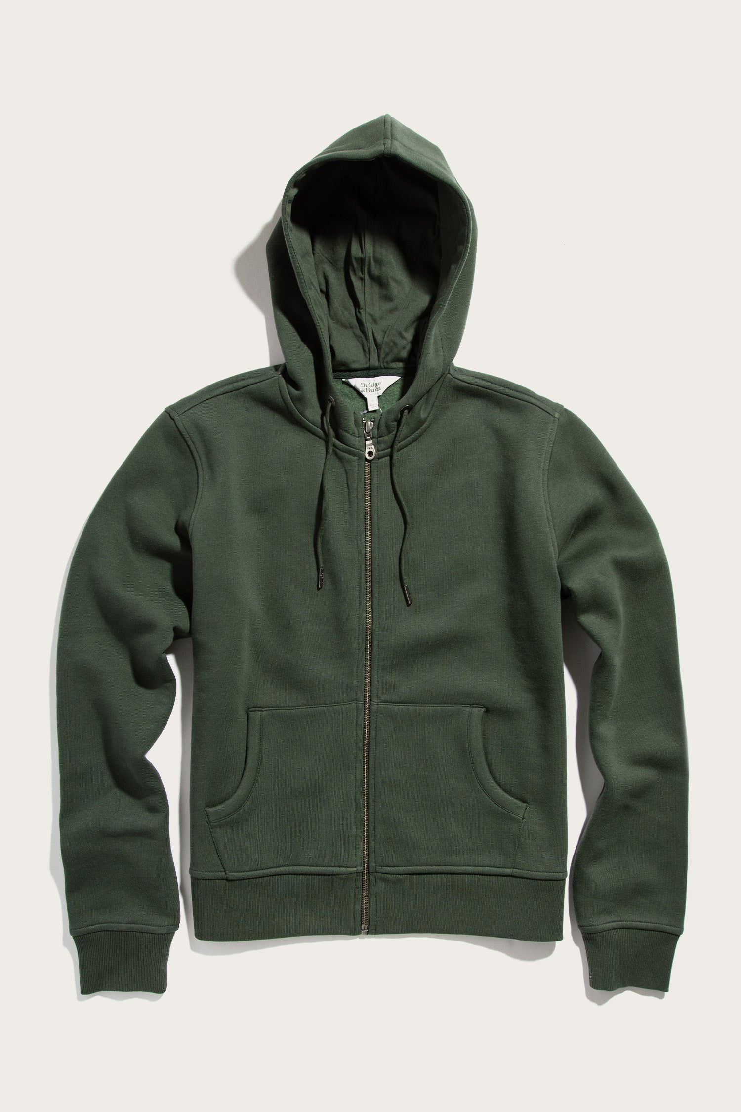 The Bridge & Burn Mason Hoodie in Forest Night is a sustainable zip-front sweatshirt with a drawstring hood and two front pockets, shown flat on a light background.