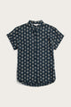 The Bridge & Burn Bea Shirt in Midnight Sundance is a tailored fit, short-sleeve button-down featuring a dark navy base with a white geometric diamond pattern, shown flat on a white surface for stylish and comfortable appeal.