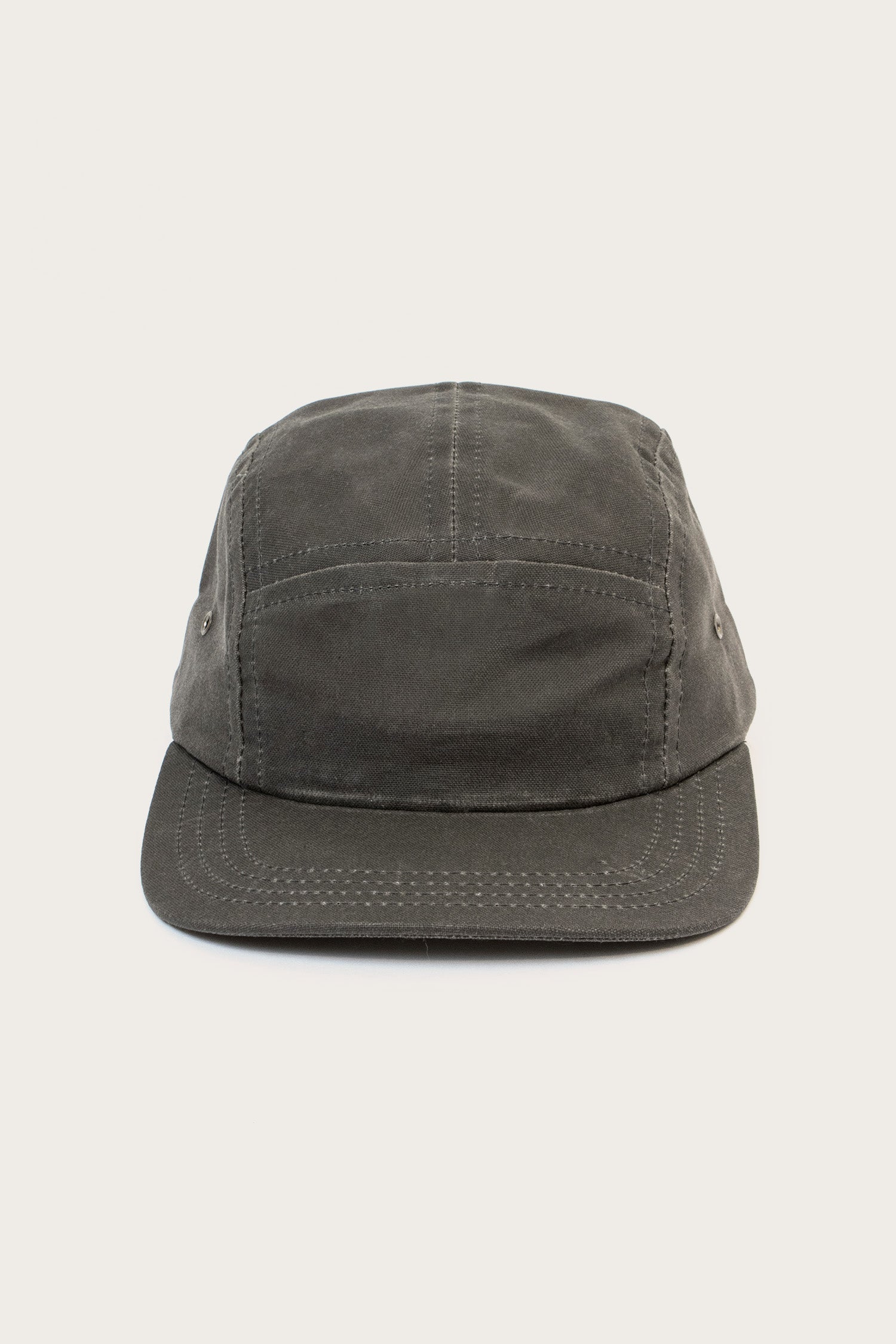 The Bridge & Burn Camper Waxed 5 Panel Cap in charcoal, with visible stitching and a flat brim, is shown against a plain off-white background.