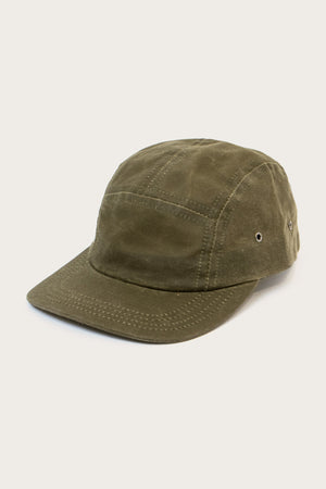 The Bridge & Burn Camper Waxed 5 Panel Cap in Moss features visible stitching, metal side eyelets, and a stiff brim. Made in the USA and shown on a plain light background.
