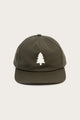 The Tree Cap / Olivewood by Bridge & Burn is a dark green pinch front hat with a white custom tree appliqué on the front, shown against a plain light background.