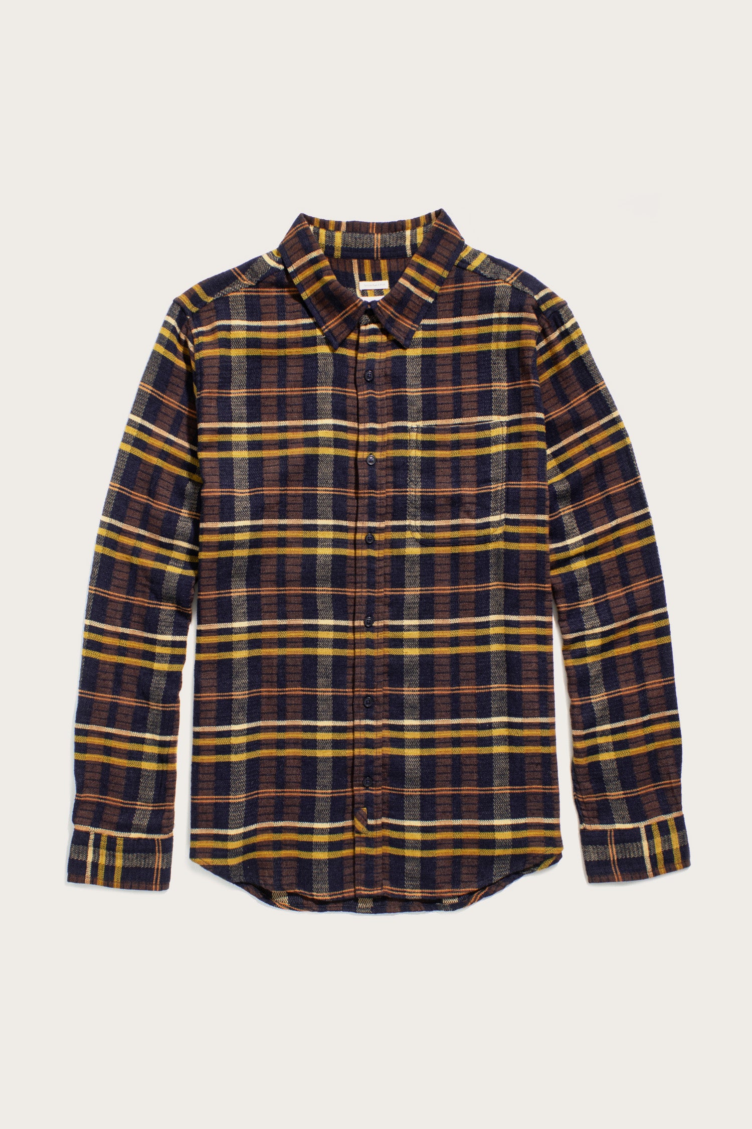 The Bridge & Burn Larson Shirt in Desert Dawn Plaid features a classic fit, long sleeves, a collar, single chest pocket, and soft organic cotton in blue, brown, and yellow brushed flannel for all-day comfort.