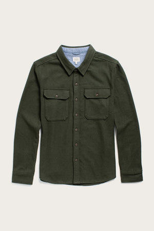 The Bridge & Burn Pointer Overshirt in Dark Sage is a long-sleeve, button-up twill shirt with two chest pockets and a collar, made from recycled fibers and shown against a plain light background.