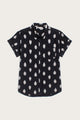 The Bridge & Burn Bea Shirt in Eclipse Ikat features a black background with a white abstract dot pattern, short sleeves, a left chest pocket, and is crafted from 100% cotton. The shirt is shown laid flat on a plain light background.