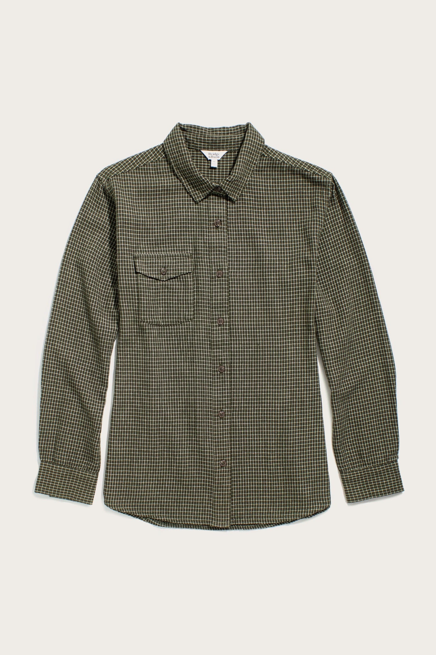 The Bird Shirt / Olive Grid Plaid by Bridge & Burn features a relaxed fit, long sleeves, olive and black plaid pattern, pointed collar, chest flap pocket, and straight hem—ideal for classic men's casual style.