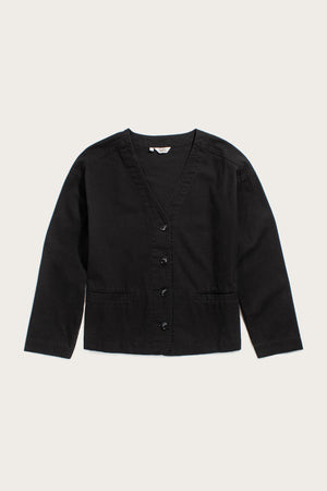The Bridge & Burn Lee Jacket in black canvas features a modern boxy fit, V-neckline, button-down front, and two front pockets, shown laid flat on a light background.