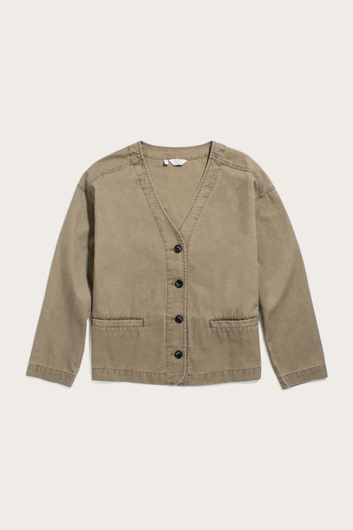 The Lee Jacket by Bridge & Burn is a khaki green canvas cardigan with long sleeves, black front buttons, two pockets, and a V-neck, shown laid flat on a light background.