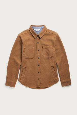 The Bridge & Burn Dawson Overshirt in Camel features a pointed collar, two chest pockets, long sleeves, and a rounded hem. Made from recycled cotton, this heavyweight overshirt is shown flat on a white background.