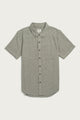 The Bridge & Burn Bryce Shirt in Olive Twill is a short sleeve, button-down men’s shirt with a left chest pocket, made from recycled cotton for sustainability, shown laid flat on a white background.