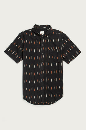 The Harbor Slim Shirt / Dotted Horizon by Bridge & Burn is a lightweight black summer cotton shirt, short-sleeved with a collar, front pocket, and an all-over pattern of vertical orange, tan, and white dashes.