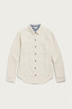 The Bridge & Burn Dawson Overshirt in Ivory Twill is a cream-colored, recycled cotton button-up with brown buttons, a light blue inner collar lining, two chest pockets, side pockets, and long sleeves. Laid flat on a white background.
