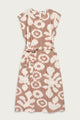 The Eloise Dress in Pop Leaf by Bridge & Burn features a sleeveless A-line cut, round neckline, abstract beige and white print, and a matching fabric belt—an essential piece for any wardrobe.