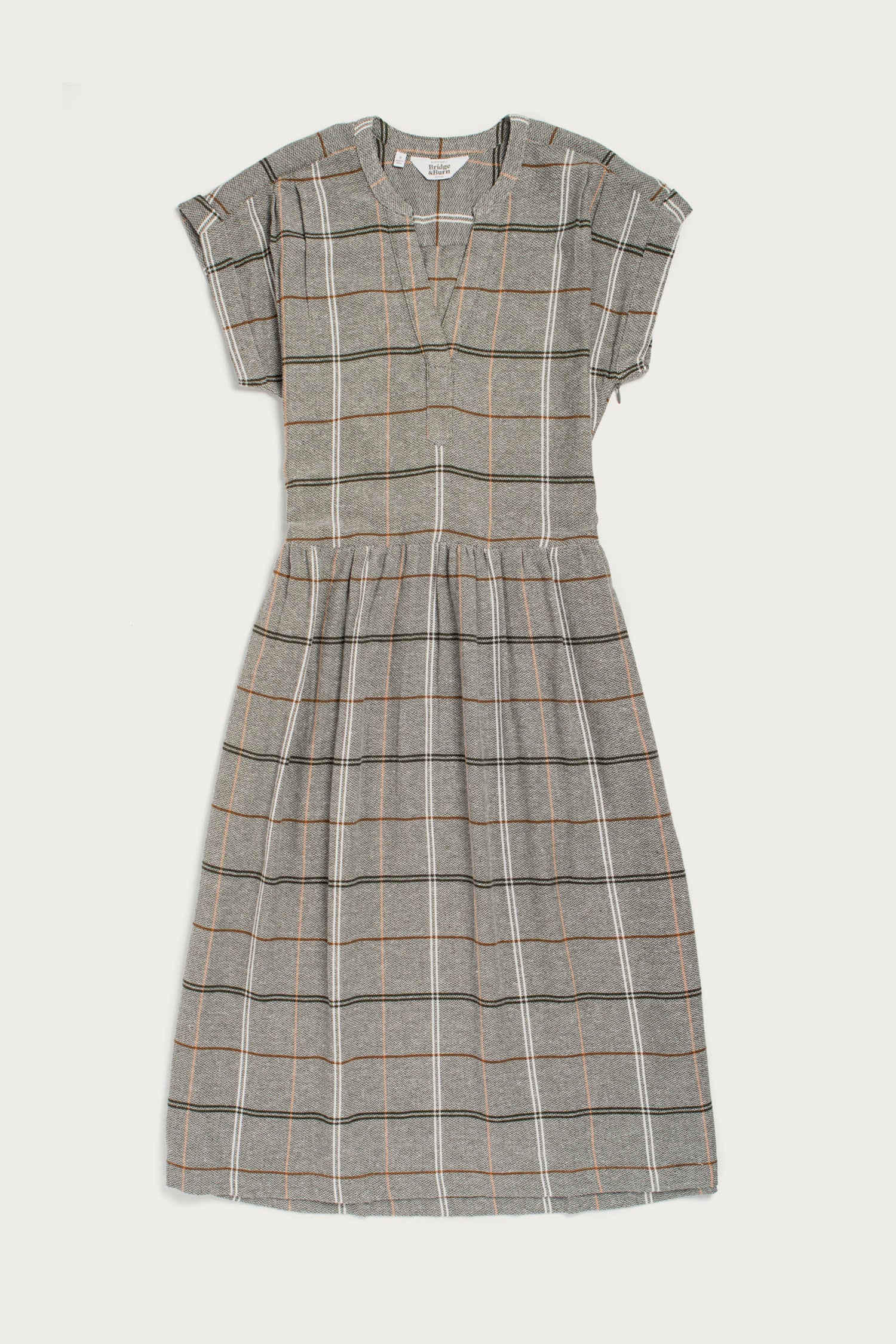 The Ira Dress by Bridge & Burn features short sleeves, knee-length cut, and a pullover style with a wrinkle-resistant olive base and an ember grid plaid. Designed with a v-neckline and gathered waist for easy, polished style.