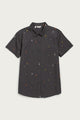 The Bridge & Burn Lana Shirt in Midnight Rain is a relaxed fit, short sleeve black button-up with a collar and chest pocket, made from 100% cotton and detailed with small red, yellow, and white vertical lines. Laid flat on white.