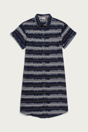 The Loren Shirt Dress by Bridge & Burn features a short-sleeve, button front design with a collar in a navy and white striped pattern. Made from 100% cotton, this relaxed-fit work dress ensures all-day comfort.