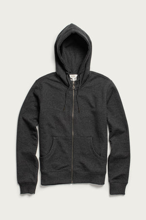 The Bridge & Burn Mason Hoodie in Graphite is a sustainable, dark gray French terry hoodie featuring a front zipper, two pockets, and an adjustable drawstring hood, shown laid flat against a light background.