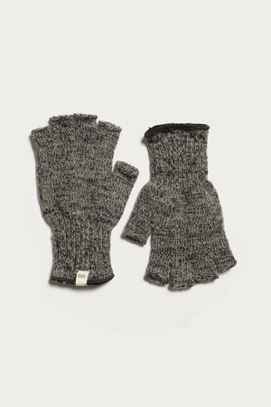 Bridge & Burn's Ragg Wool Fingerless Glove in Charcoal features a ribbed texture and a small white tag near the wrist. Shown on a white background, these cozy gloves keep your hands warm while leaving your fingers free.