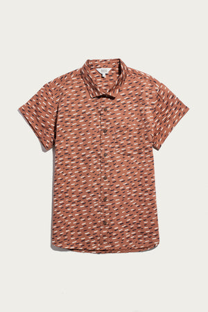 The Bea Shirt / Desert Rain by Bridge & Burn is a rust-colored, short-sleeve organic cotton button-down with scattered white and black lines, shown flat on a plain white background.