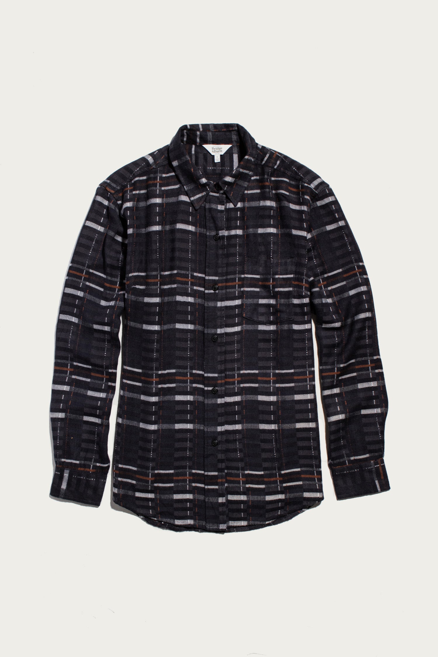 The Haley Shirt by Bridge & Burn features a relaxed fit, long sleeves, and Nightfall Stripe pattern. This button-up is shown laid flat on a white background.
