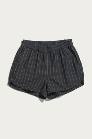 The Luca Track Short in Charcoal Stripe by Bridge & Burn is shown on a plain white background. Featuring light vertical pinstripes, an elastic waistband, and side pockets, these breathable cotton-linen blend shorts combine comfort and style—perfect for warm-weather days.