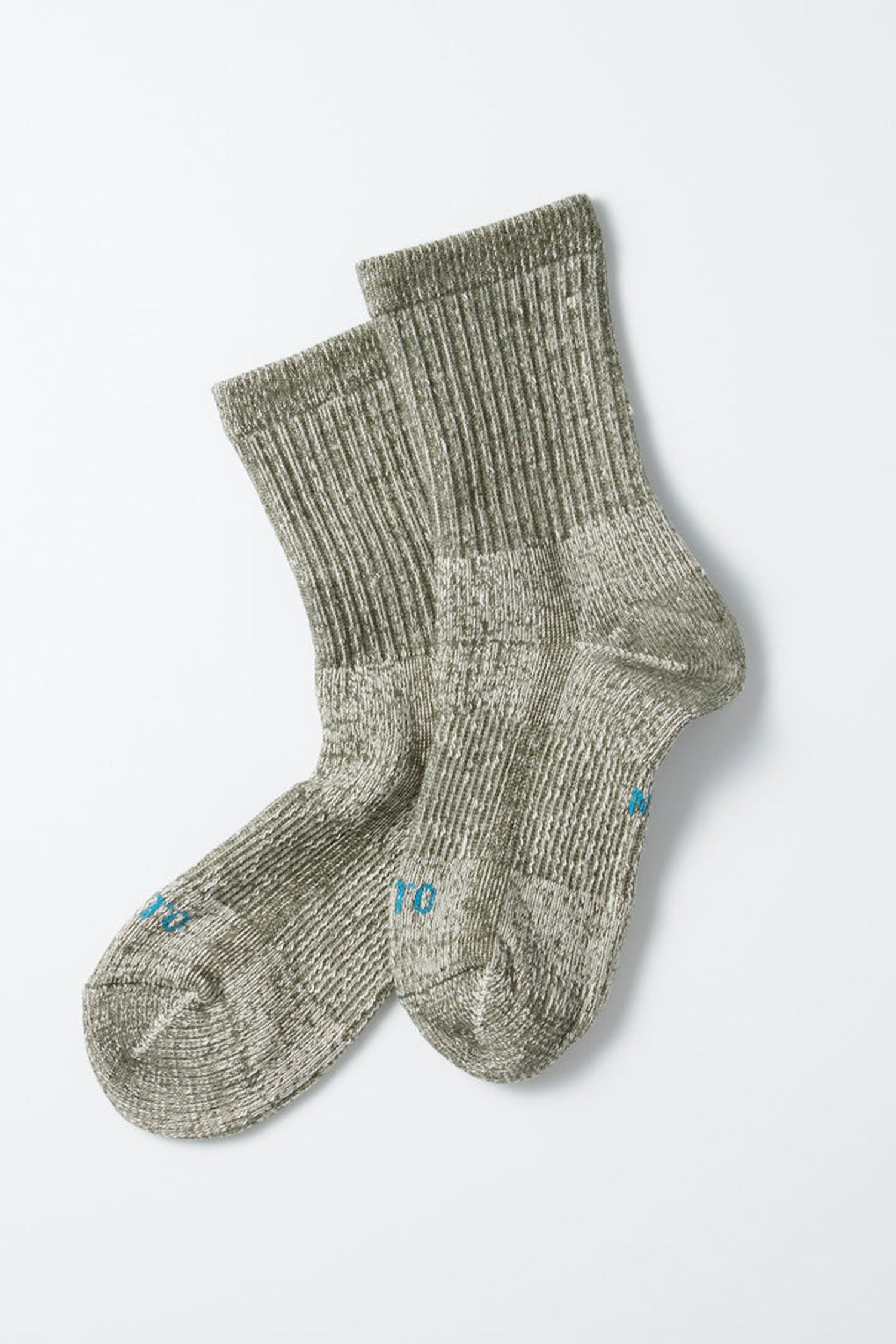 A pair of thick, ribbed olive organic cotton RoToTo Double Face Mini Crew Socks by RoToTo, featuring blue text on the toes, laid out overlapping each other on a plain white background.