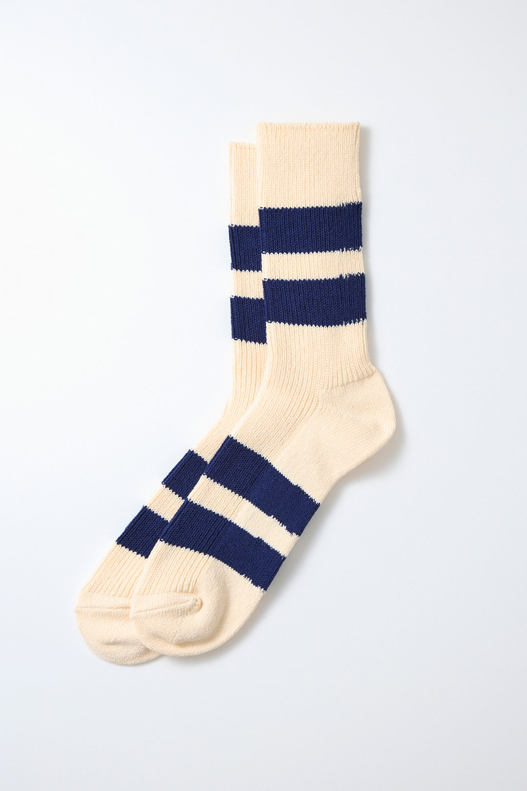 RoToTo Recycled Cotton Stripe Socks in Ecru Blue, featuring thick horizontal navy blue stripes, made in Japan and laid flat on a white background.