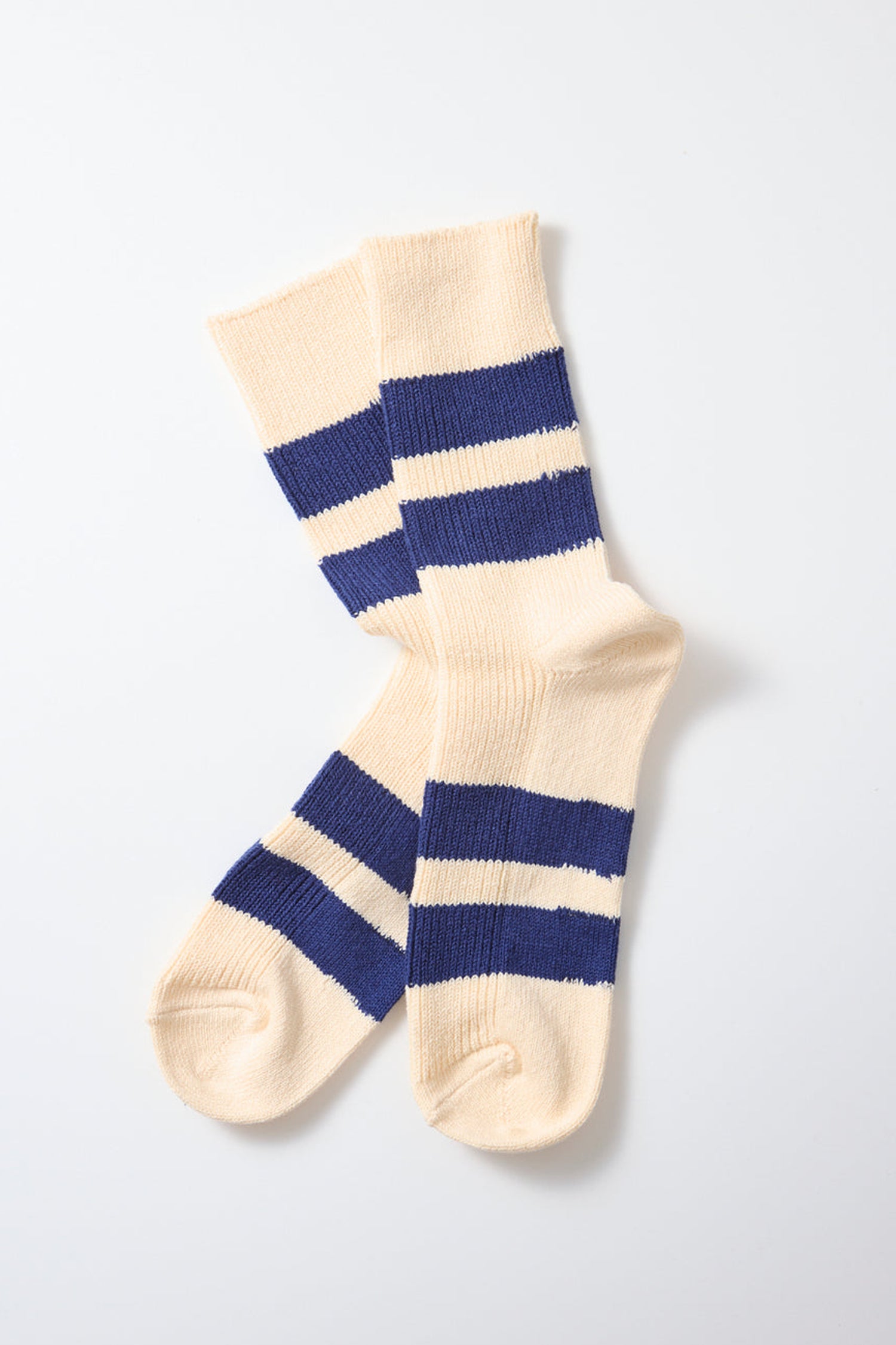 A pair of RoToTo Recycled Cotton Stripe Socks in Ecru Blue, featuring thick horizontal navy stripes and crafted in Japan from recycled cotton, laid out on a white background.