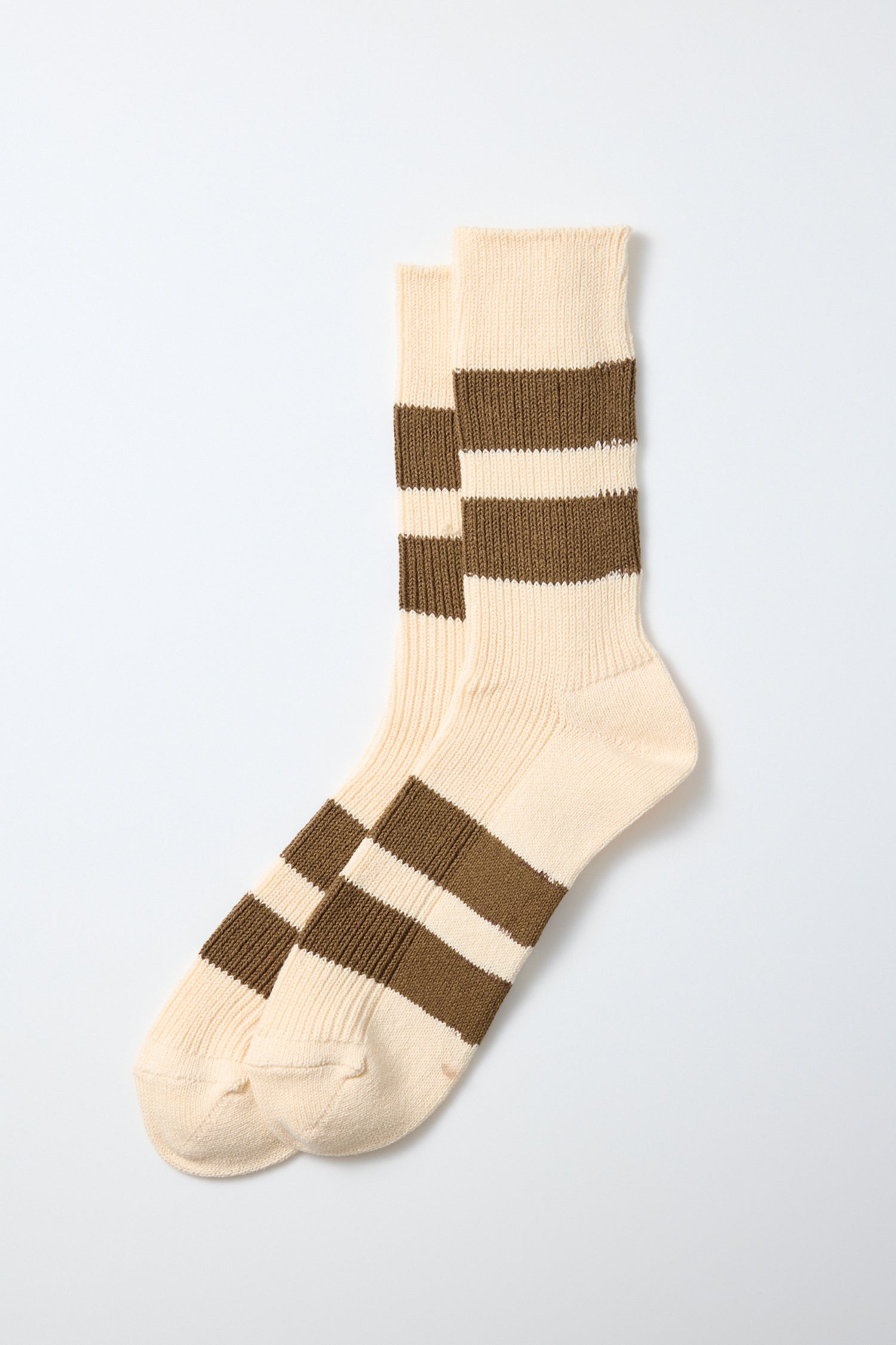 A pair of RoToTo Recycled Cotton Stripe Socks in Ecru Moss, featuring two thick brown horizontal stripes around the calves and feet, made in Japan by RoToTo and displayed on a plain light background.