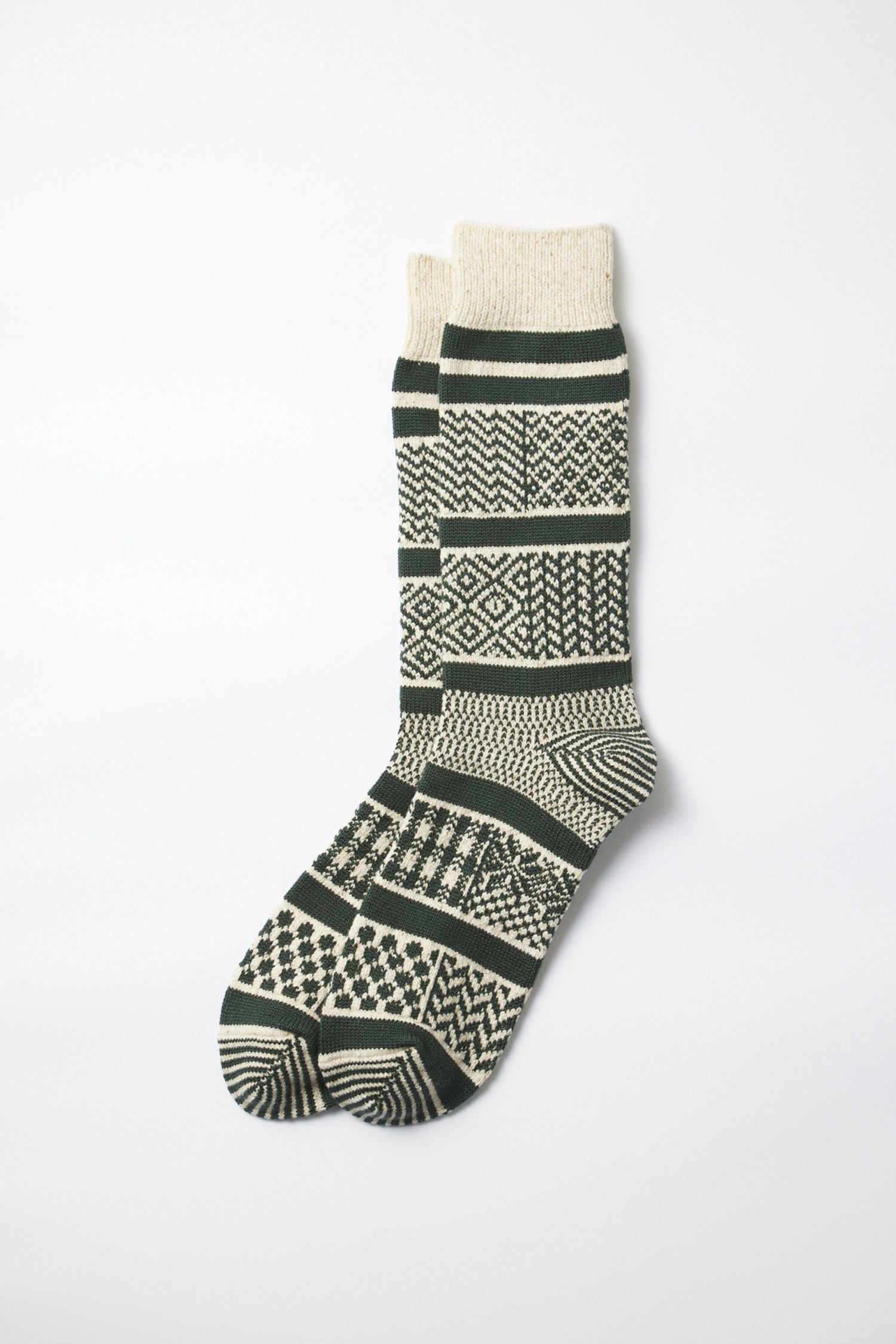 A pair of RoToTo Multi Jacquard Socks in Ivory Gold, featuring geometric patterns, displayed flat on a white background.