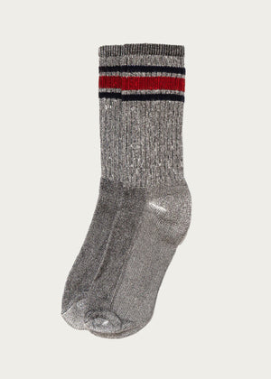 The American Trench - Merino Activity Crew / Grey socks feature a gray ribbed design with moisture-wicking merino wool, metallic sheen, and two horizontal stripes—one red and one black—near the cuffs, shown on a white background.