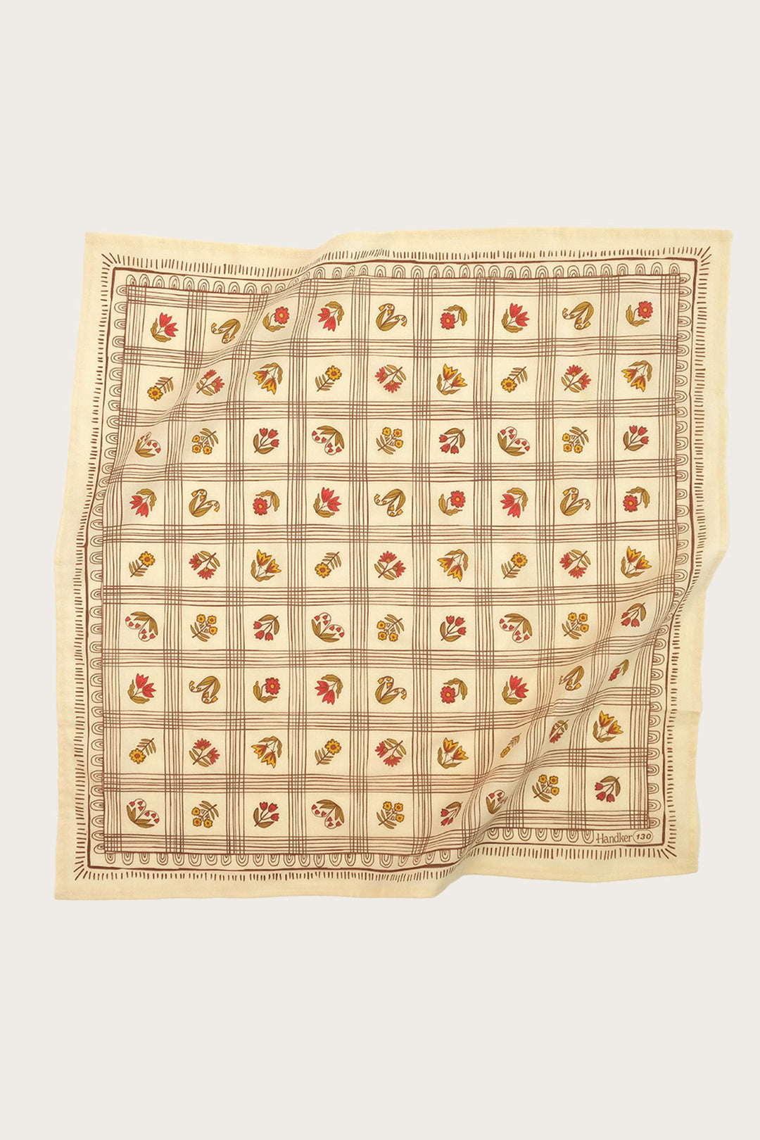 The Handker Bandanas - No. 130 Laura Bandana is a cream-colored, square cotton accessory with a grid pattern and colorful leaf or floral motifs, screen-printed by hand, bordered with decorative trim—versatile and stylish from Handker Bandanas.