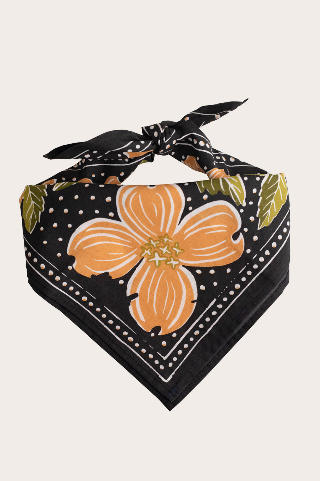 The Handker Bandanas - No. 046 Amy Bandana by Handker Bandanas is a black cotton bandana with orange and yellow dogwood flowers, green leaves, white dots, and a top knot.
