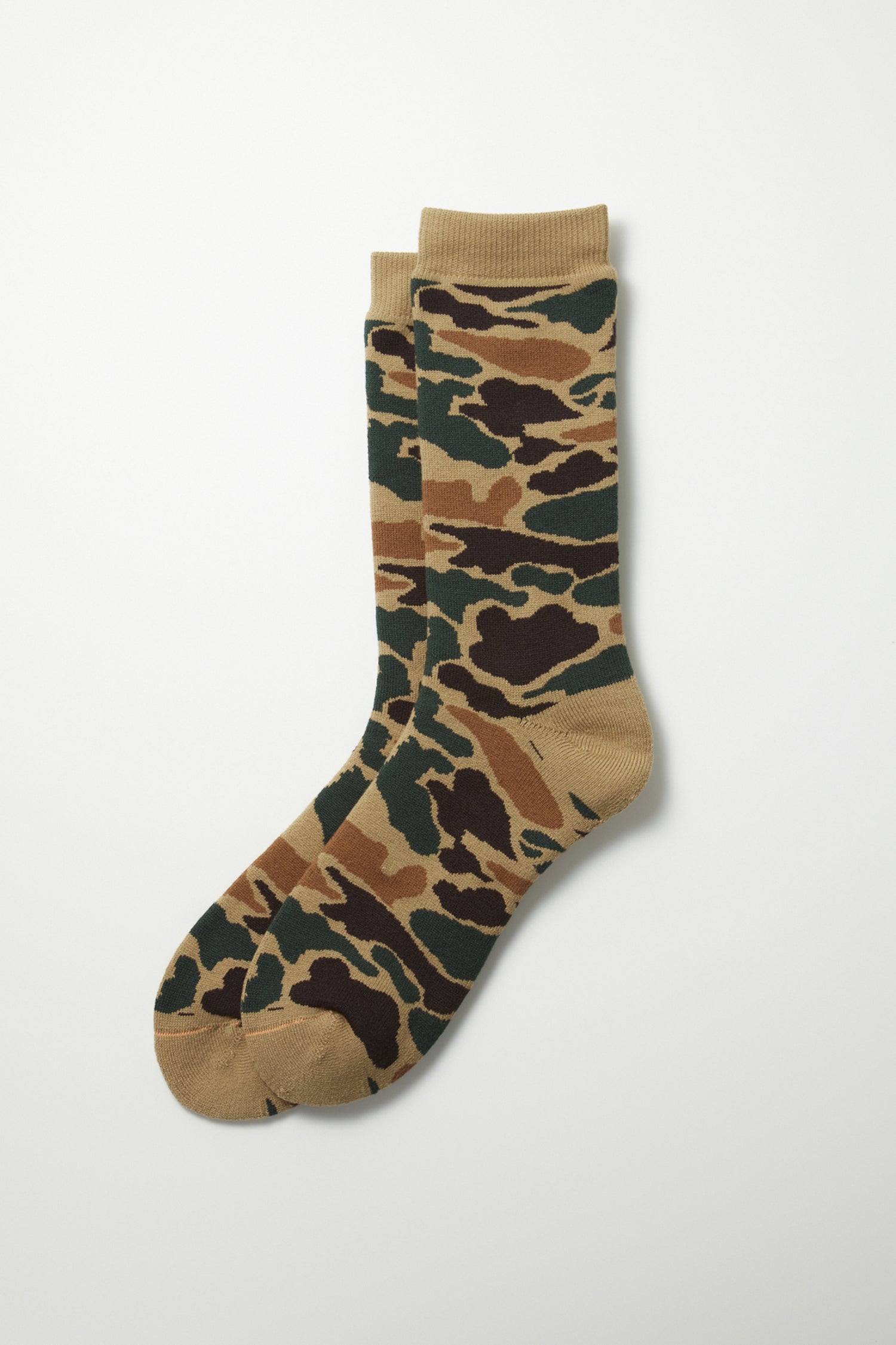 The RoToTo Pile Camo Crew Socks in Khaki by RoToTo feature a brown, green, tan, and black camouflage pattern. Made in Japan, these crew socks are displayed flat on a white background.