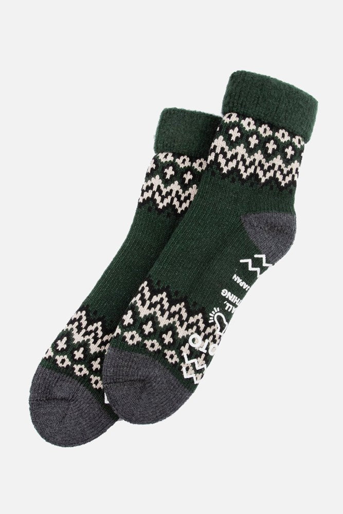 RoToTo Comfy Room Socks / Nordic Dark Green by RoToTo: green and dark gray knit socks with a white geometric pattern, solid dark gray toes and heels, plus non-slip soles for cozy lounging. Shown on a white background.