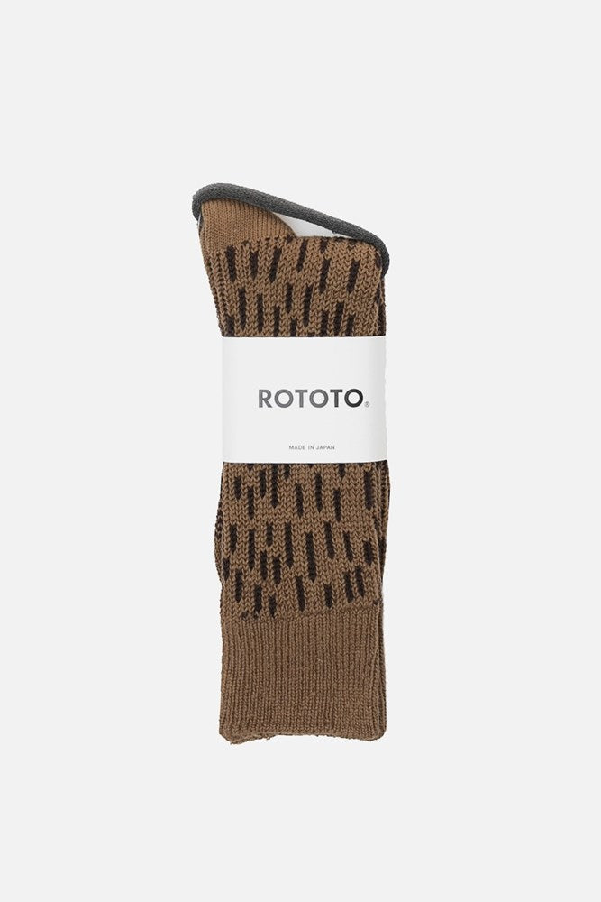 A pair of RoToTo Rain Drop Socks in Khaki Dark Brown, featuring a black dashed pattern and a white "RoToTo. MADE IN JAPAN" label, displayed folded against a plain white background.