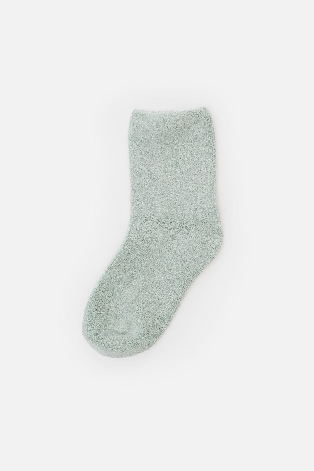 A single Le Bon Cloud Sock in Bay—a light green, fuzzy terry knit made from soft US-grown cotton—is shown on a plain white background.